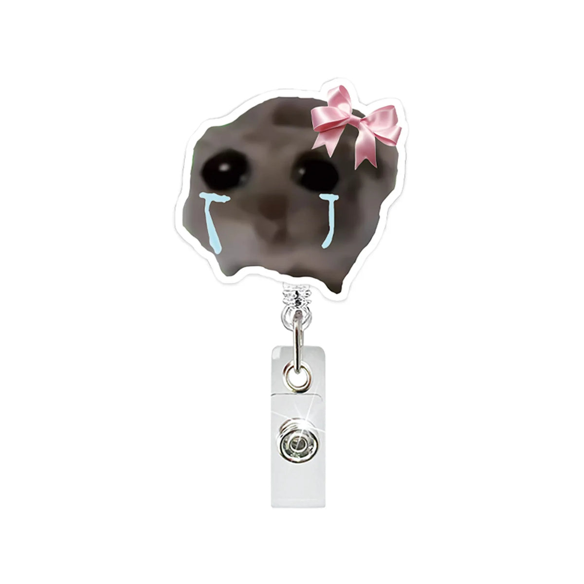 A cute hamster face charm with teary eyes and a pink bow attached to a retractable badge reel.