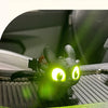 A glowing green Toothless car ornament with movable wings displayed on a car interior surface.