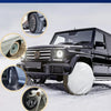 A black truck is shown with various tire covers and protection features for harsh weather conditions.