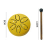 A yellow mini steel tongue drum with six tuning holes and a wooden mallet shown next to a measurement scale.