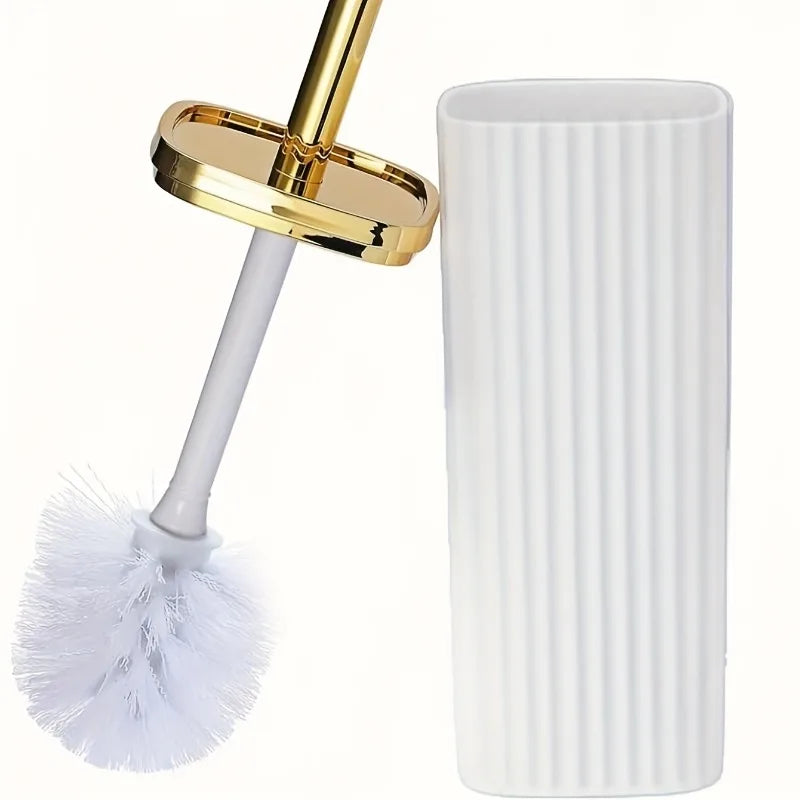 A white toilet brush set featuring a gold-colored rotating head and an adjustable stand.
