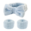 Light blue microfiber wrist washing bands or face-saving cuffs with a bow detail