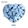 A pile of light blue silicone heart and star-shaped beads for DIY jewelry making
