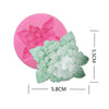 Pink and green silicone molds shaped like flowers for baking and crafting