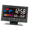 A black digital weather station clock displaying the time 12:58, temperature 26.8°C, and weather icons.
