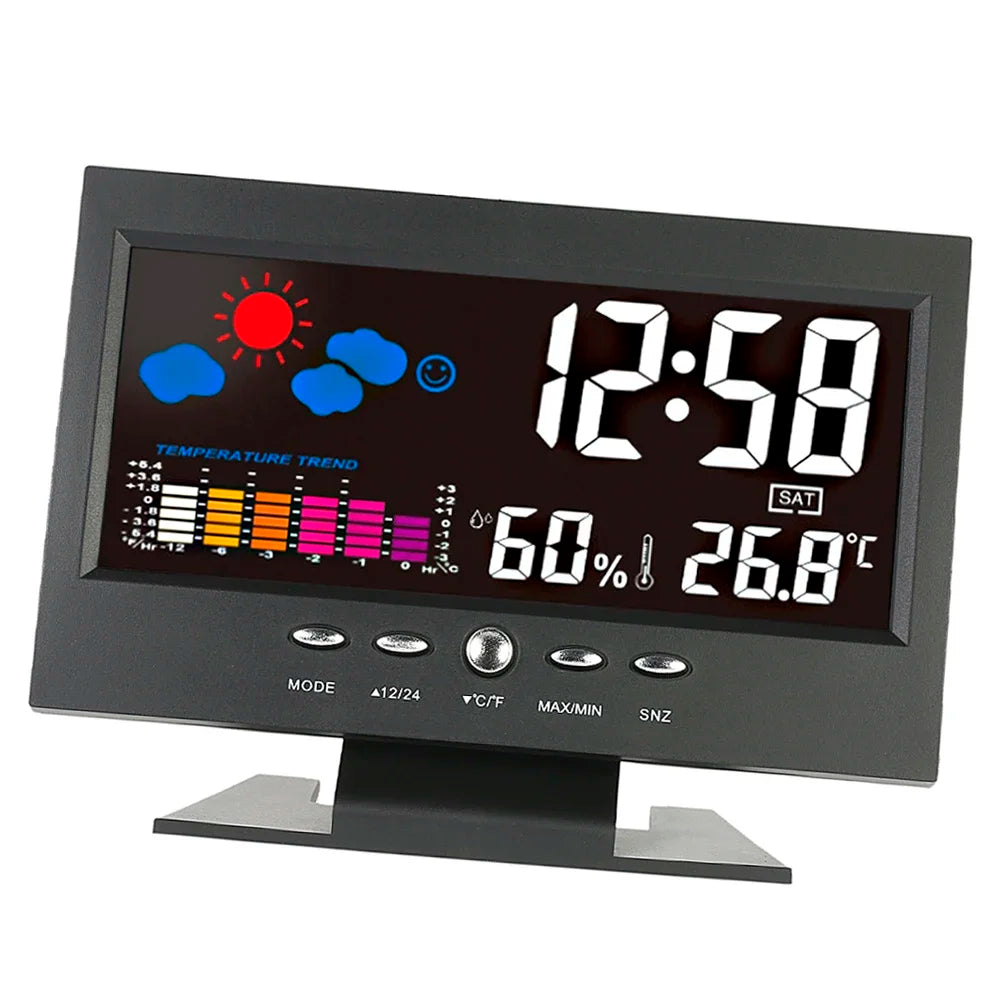 A black digital weather station clock displaying the time 12:58, temperature 26.8°C, and weather icons.