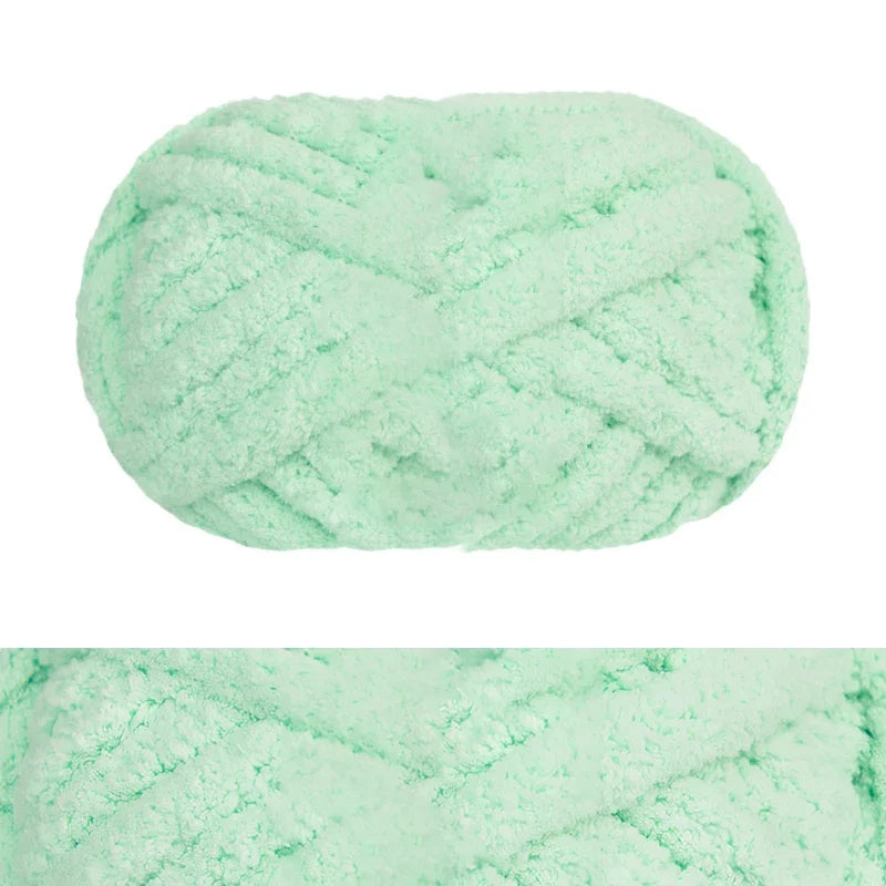 A ball of light mint green chunky chenille yarn for hand knitting and crochet