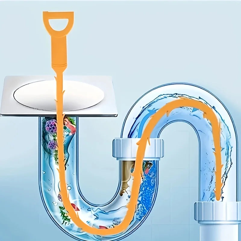 An orange flexible drain cleaning tool is shown being used to clear a curved plastic drain pipe.