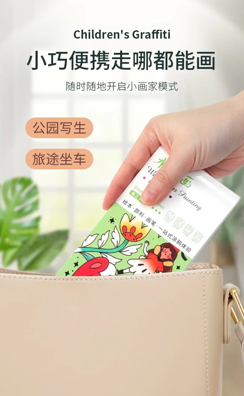 A hand is holding a portable watercolor painting book with a brush for children inside a beige handbag.