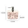A pink ceramic pump dispenser with a silver pump mechanism for bathroom essentials.