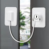 A white self-adhesive window safety lock with two keys mounted on a gray door frame.