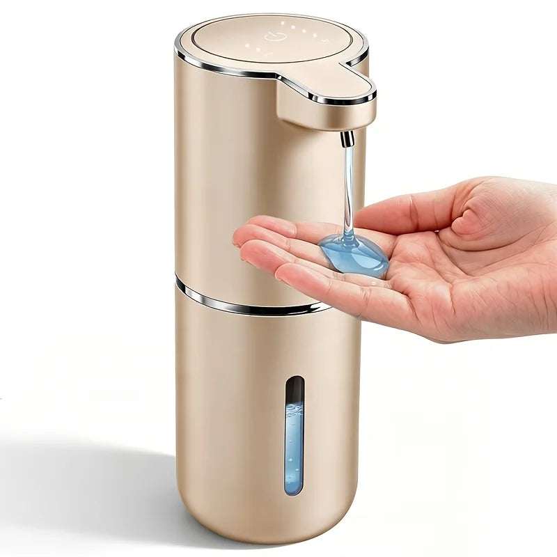 A hand is dispensing liquid from a modern, beige touchless automatic soap dispenser.