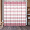 A pink and white striped waffle weave shower curtain hanging on a rod.