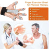 A hand holding a finger exerciser with a wrist strap, demonstrating its use for physical therapy.