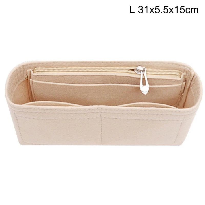 Light beige felt bag organizer with multiple zippered pockets and a hanging loop