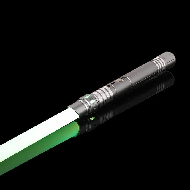 A black lightsaber with a green blade and metallic hilt is shown against a black background.