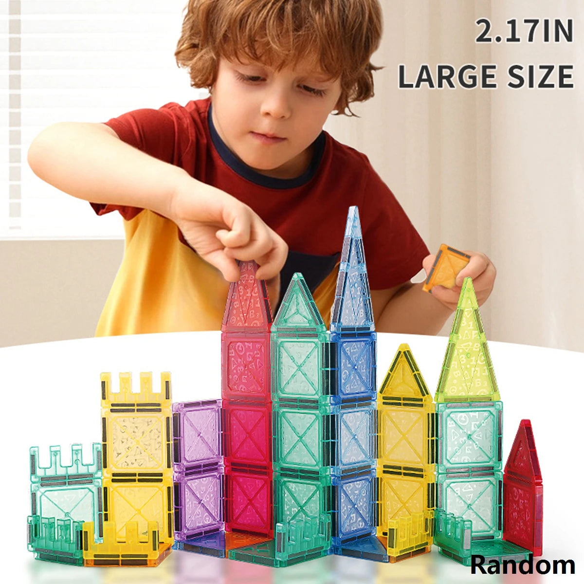 A child is building a tower with colorful magnetic tiles, showing various sizes and colors like pink, blue, yellow, and green