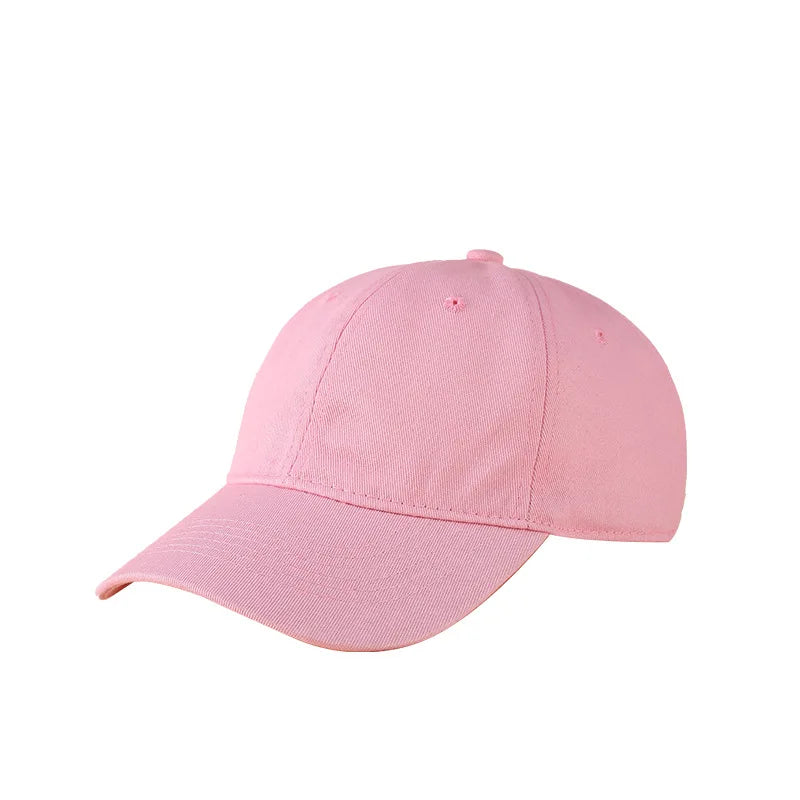 A pink classic cotton dad hat shown from the side.