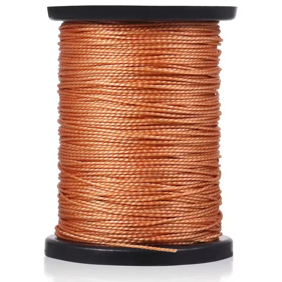A spool of orange-brown waxed thread for leather sewing kits