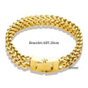 A close-up view of a chunky gold stainless steel link chain bracelet with a hinged clasp.