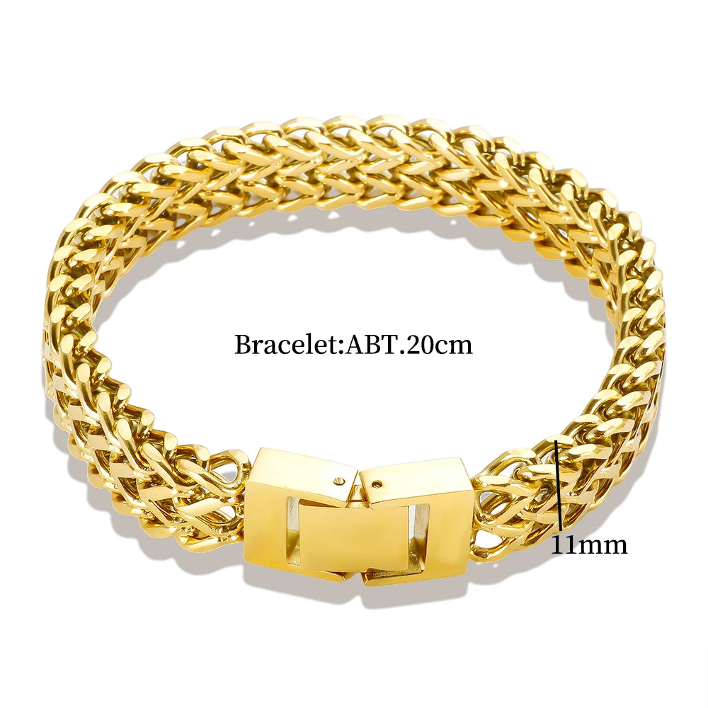 A close-up view of a chunky gold stainless steel link chain bracelet with a hinged clasp.