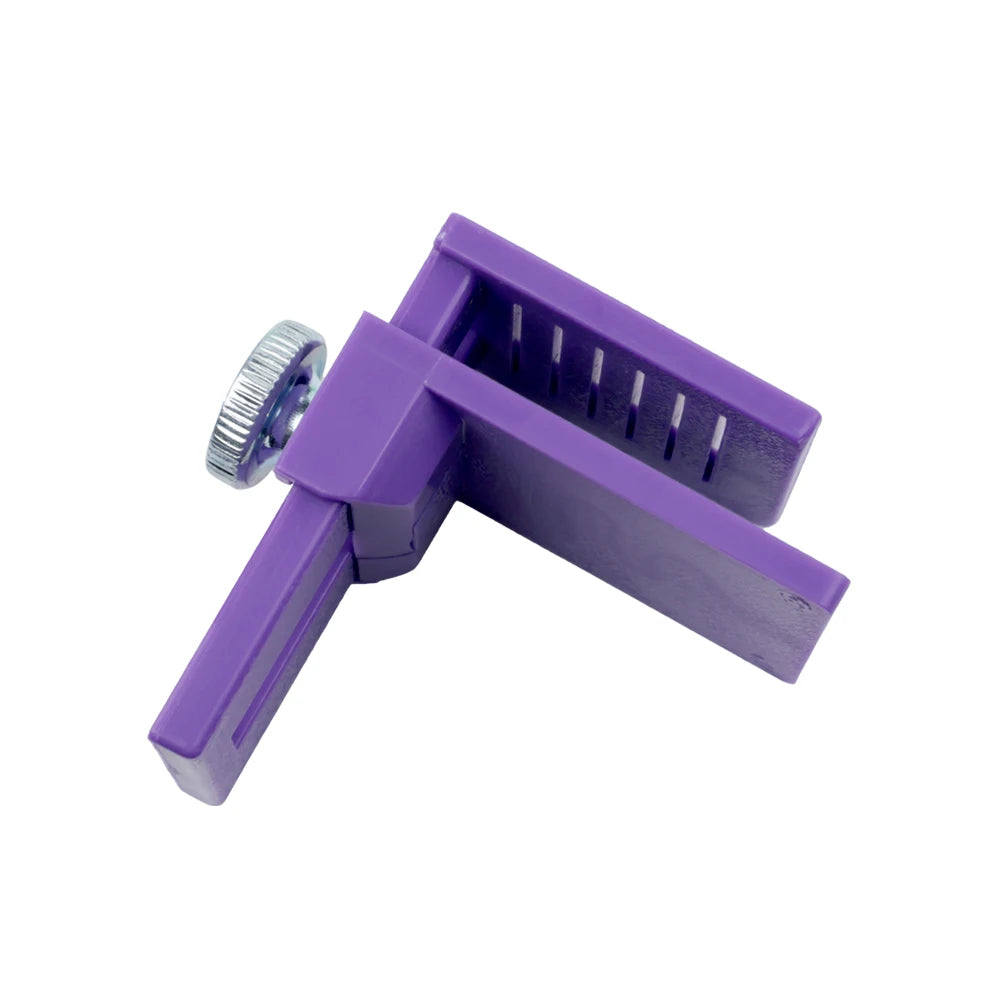 A purple precision vinyl cutting tool featuring a plastic frame and a clear measurement scale.