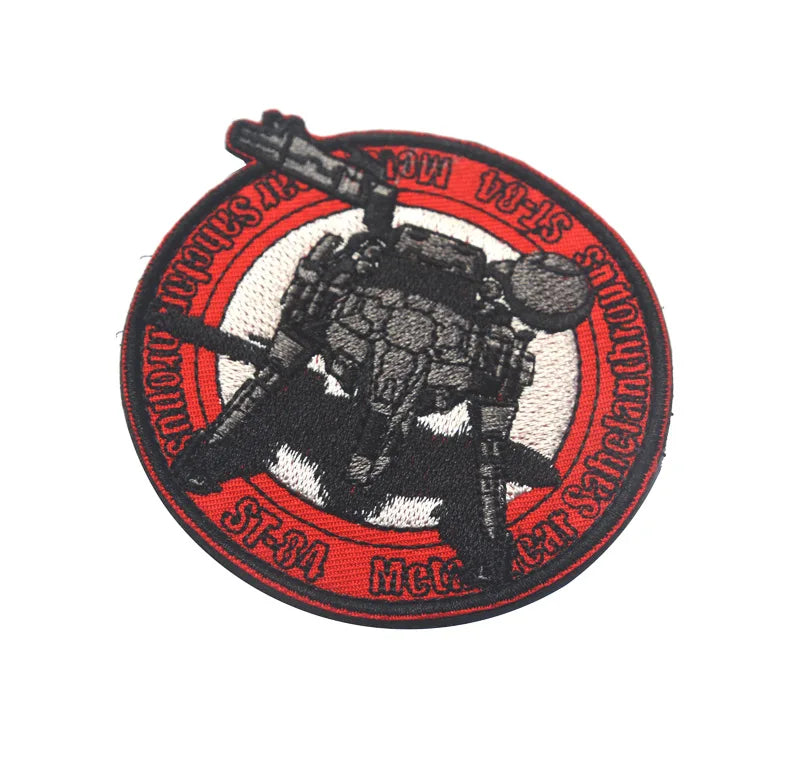 Embroidered patch featuring a silhouette of Metal Gear Foxhound with a hook and loop backing on a red circular background