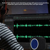 A person is using a dark blue microphone foam isolation shield in a recording studio setting.