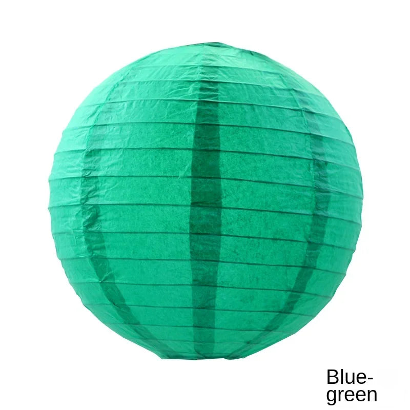 A round, teal green paper lantern with vertical folds.