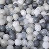A close-up view of a large pack of colorful plastic ball pit balls in various shades of gray and white.