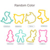 A set of random color animal-shaped playdough tools for kids, including various shapes and sizes.
