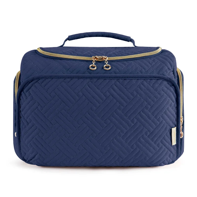 Navy quilted travel toiletry bag with a gold zipper and handle