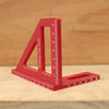 A red adjustable multi-angle measuring ruler used for woodworking and DIY projects.