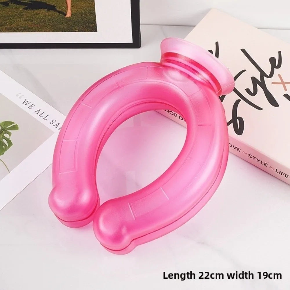 A pink U-shaped reusable neck wrap is shown on a white surface next to a book.