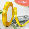 A roll of yellow gloden satin ribbon for crafts and gift wrapping