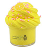 A bright yellow slime product topped with yellow frosting and pink sprinkles, displayed in a clear jar.