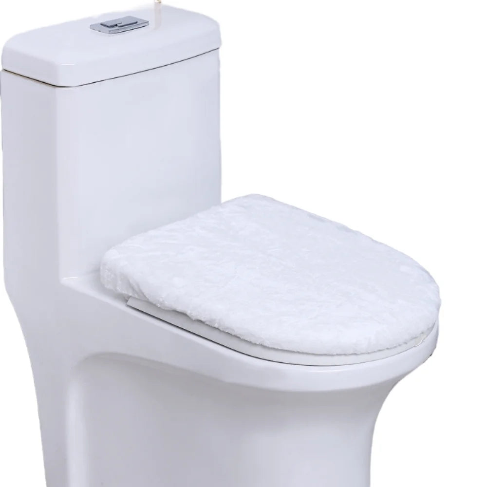 A white toilet with a soft, white flannel seat cover installed.
