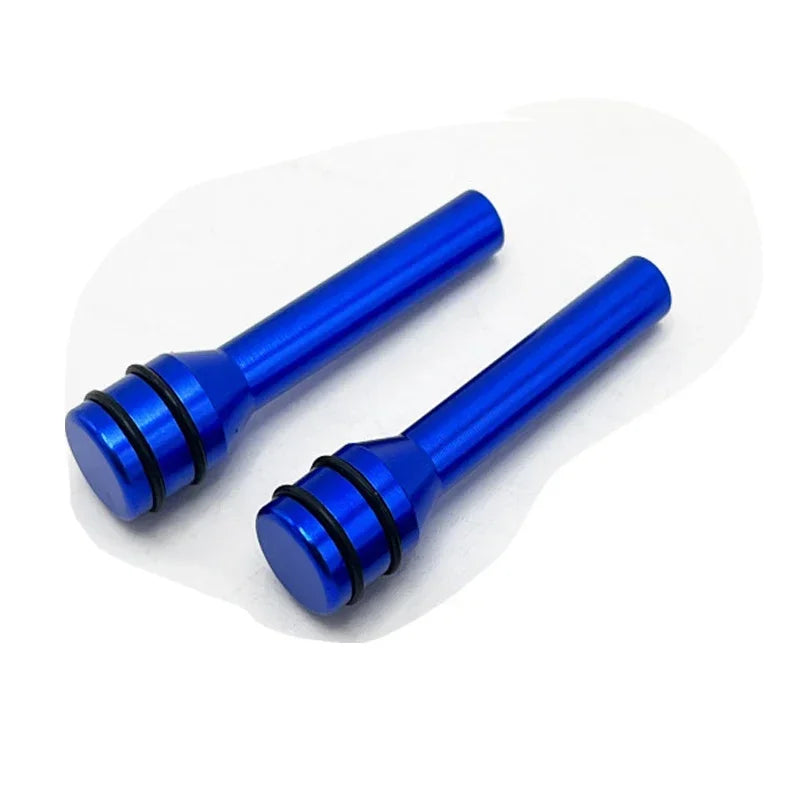 Two bright blue aluminum alloy car door lock pins shown against a white background.