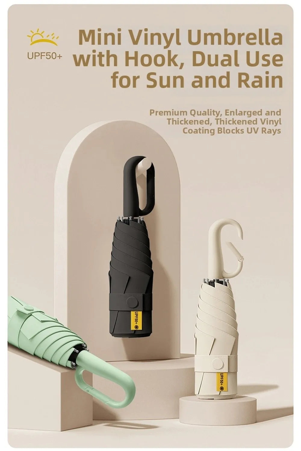 A black mini vinyl umbrella with a hook is shown next to a light green folding umbrella.