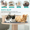 A cat is resting on a wooden cat tree, demonstrating the anti-slip features of the mat protector.