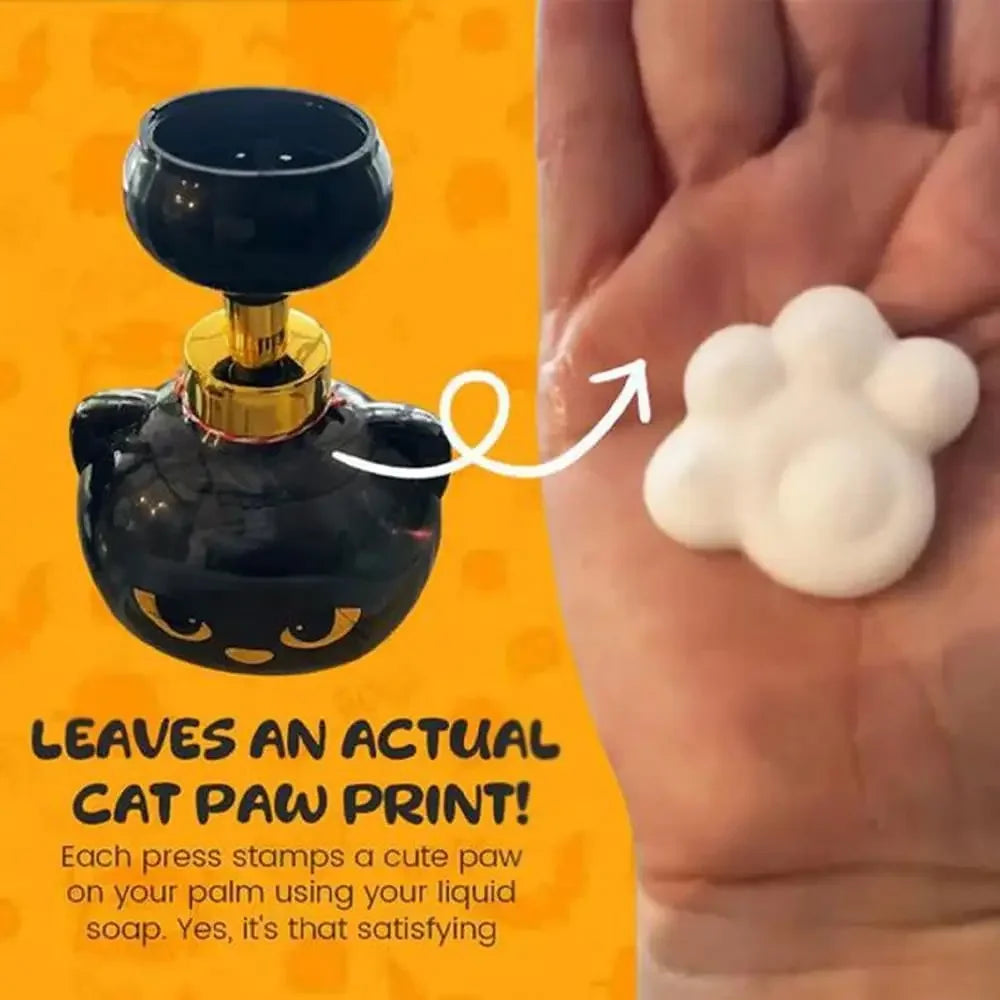 A black foam soap dispenser shaped like a cat paw is shown next to a white foam soap print on a hand.