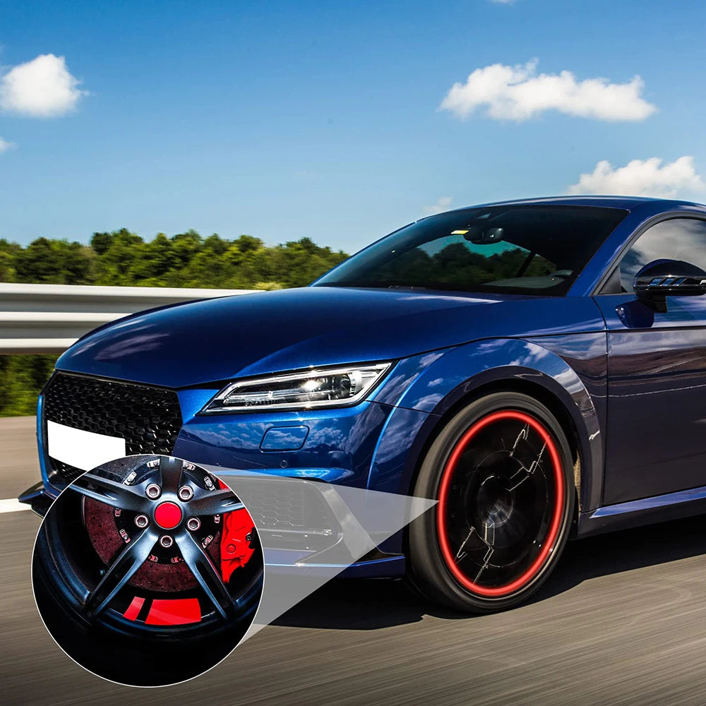 A blue sports car is shown with custom black wheels featuring red accents and reflective safety stickers.