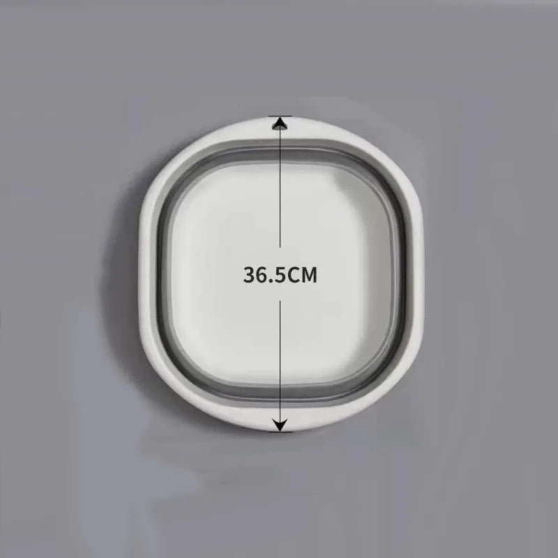 A white foldable plastic wash basin shown with dimension markings.