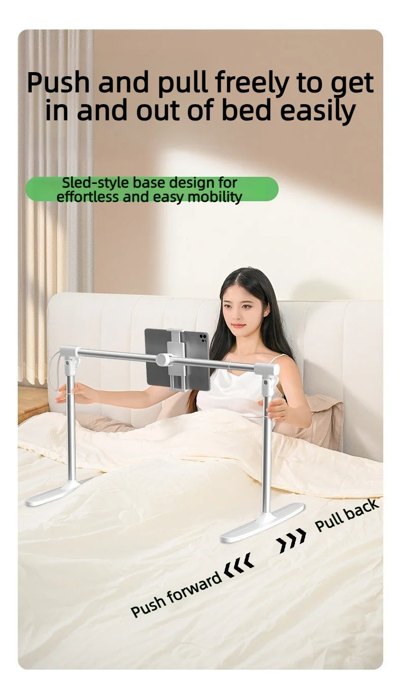 A woman is using an adjustable foldable tablet stand designed for easy movement on a bed.