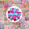 A collection of colorful acrylic beads in various styles and shades arranged in a grid.