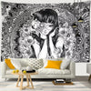 A black and white tapestry featuring a stylized portrait of a woman with dark hair and intricate, swirling patterns.
