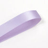 A roll of light purple double face satin ribbon.