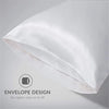 A white silky satin pillowcase is shown folded, highlighting the envelope design for easy on and off.