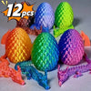 A set of twelve colorful 3D printed dragon and egg sculptures displayed on a light surface.