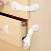 White child safety cabinet locks installed on a light wood drawer and door.